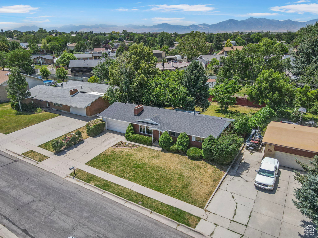 Aerial perspective of suburban area with a mountainous background