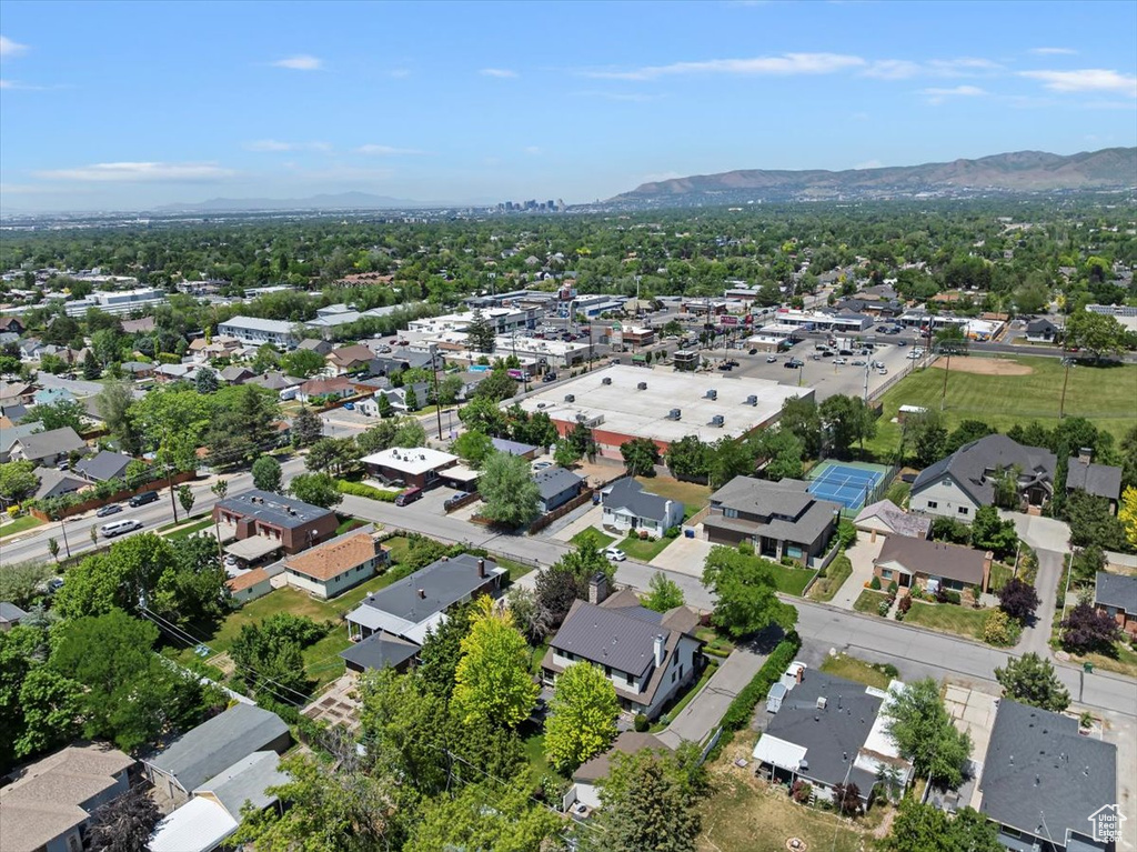 Aerial view of property and surrounding area with mountains