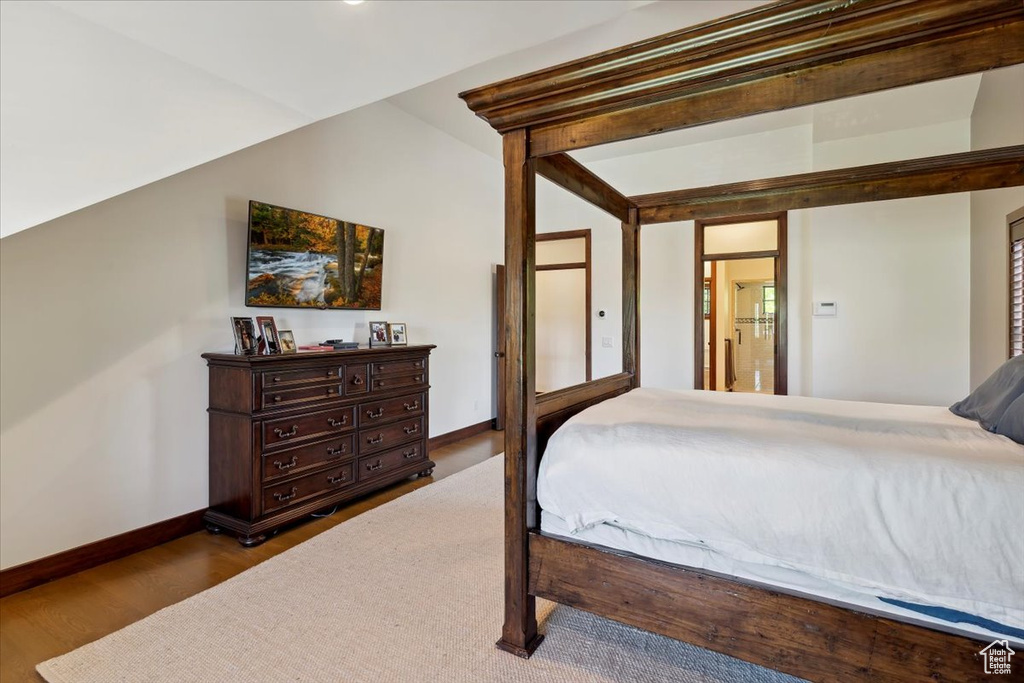 Bedroom featuring baseboards and wood finished floors