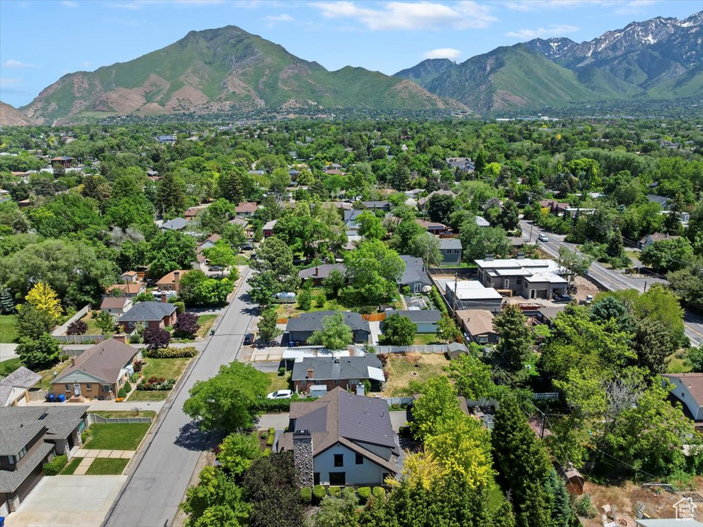 Aerial perspective of suburban area with a mountain backdrop