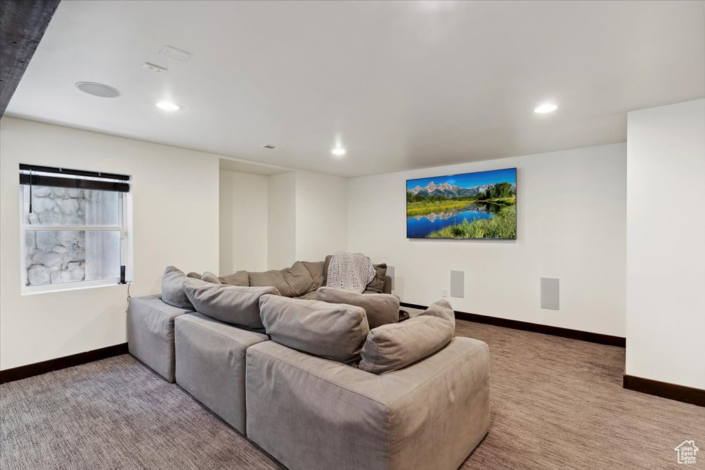 Home theater with carpet floors and recessed lighting