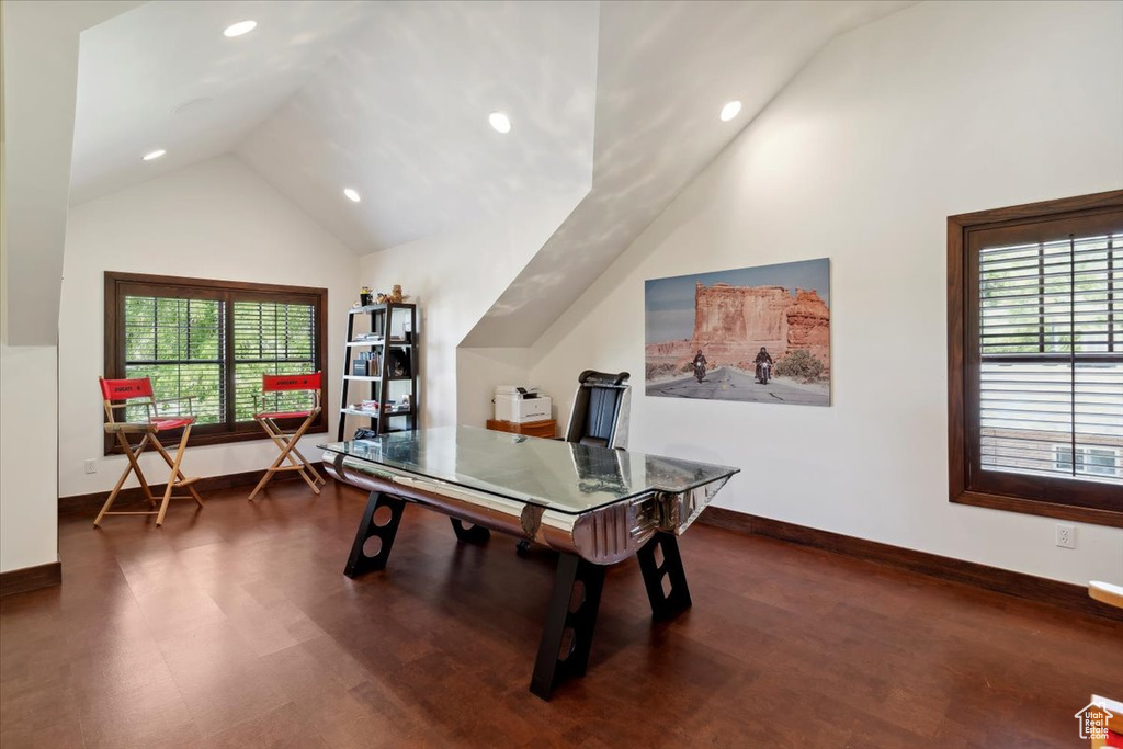 Game room with vaulted ceiling, dark wood-style floors, healthy amount of natural light, and recessed lighting