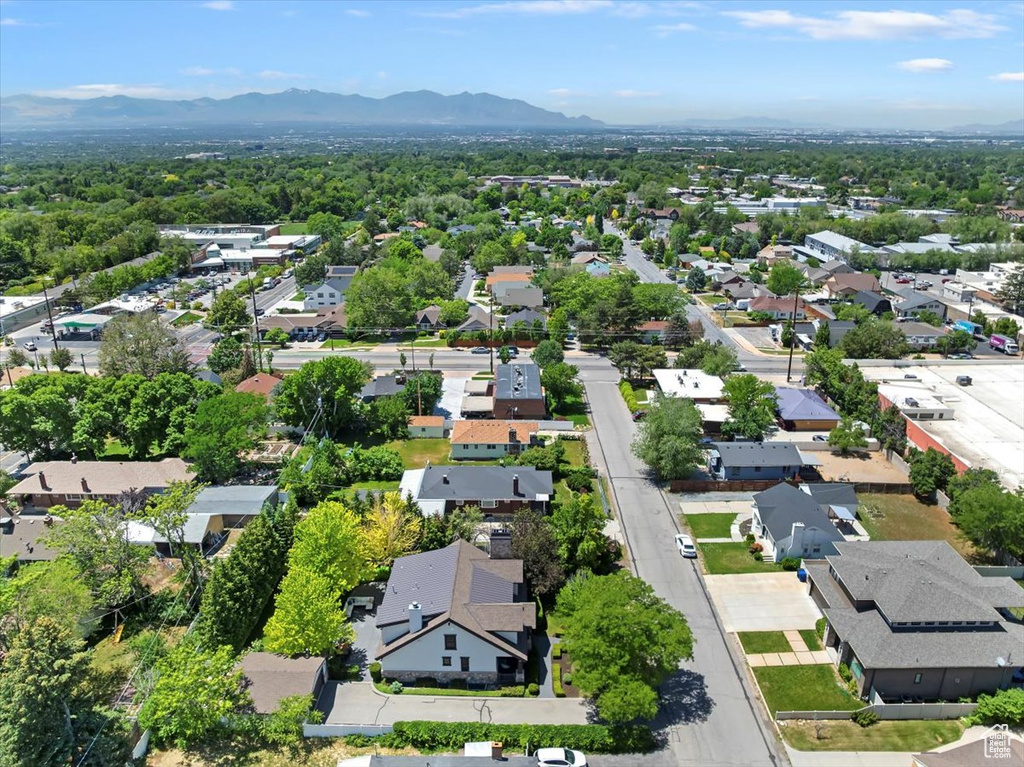 Aerial view of residential area featuring a mountain backdrop