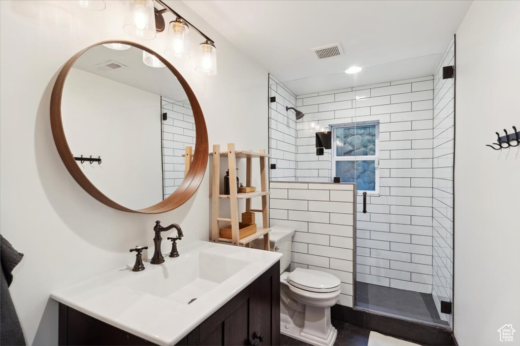 Full bath featuring vanity and a stall shower