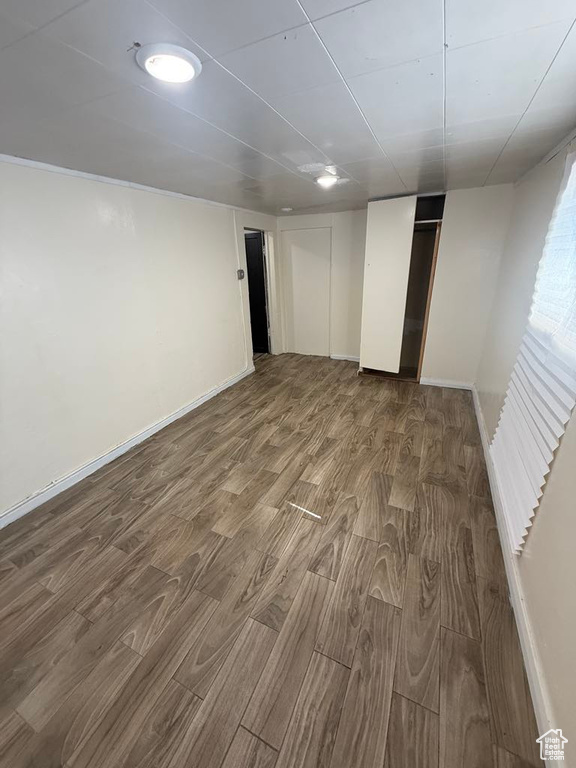 Below grade area featuring wood finished floors and baseboards