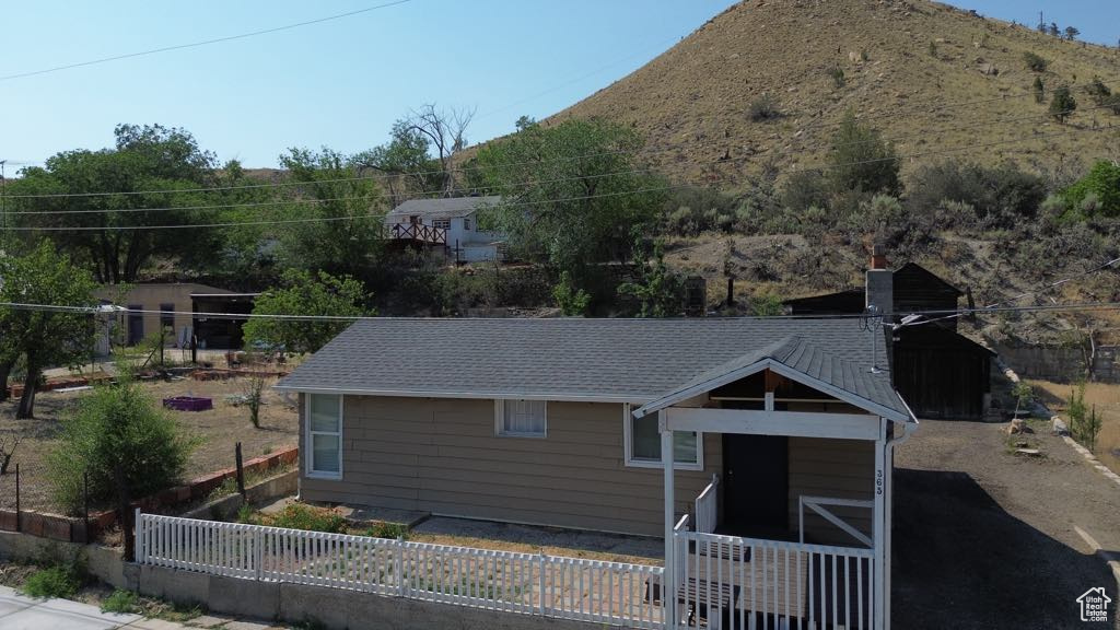 View of front of house featuring a mountain view and a chimney
