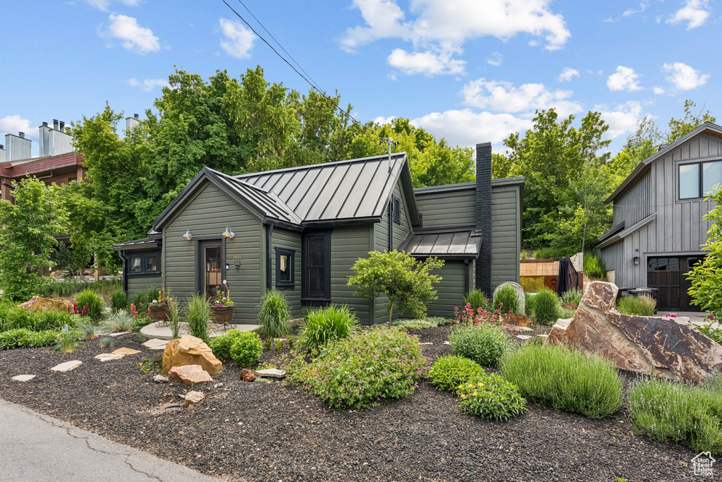 View of front of property featuring a standing seam roof and a metal roof