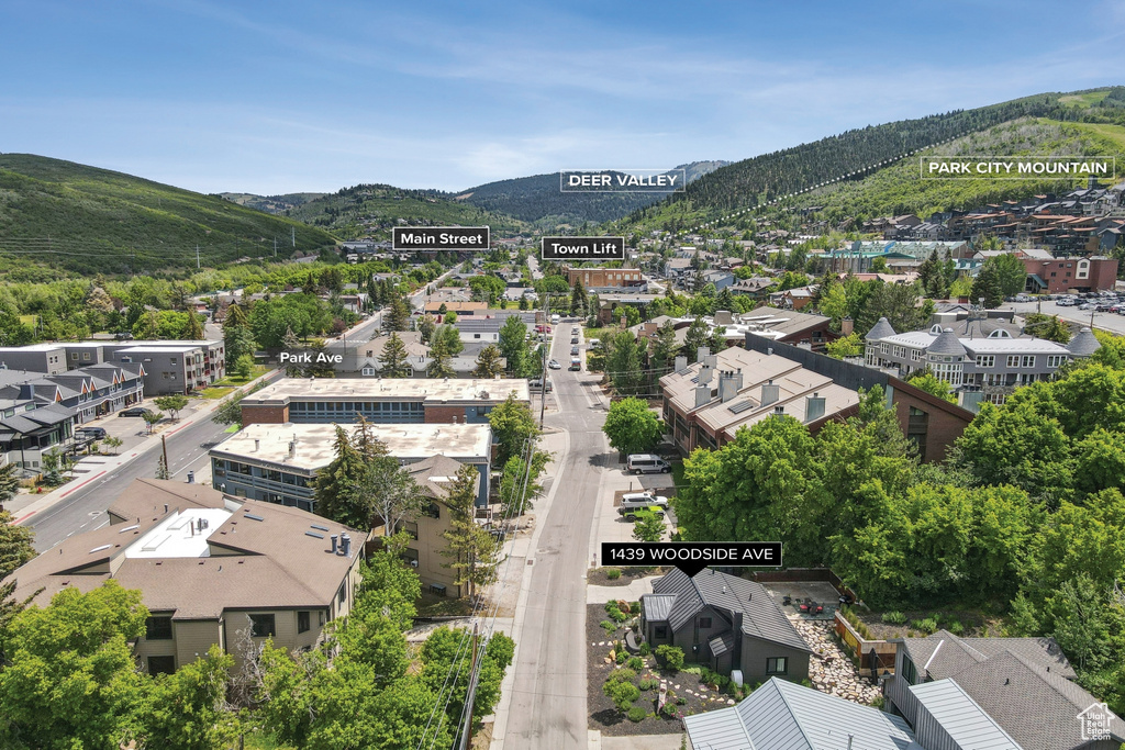 Aerial perspective of suburban area with a mountainous background