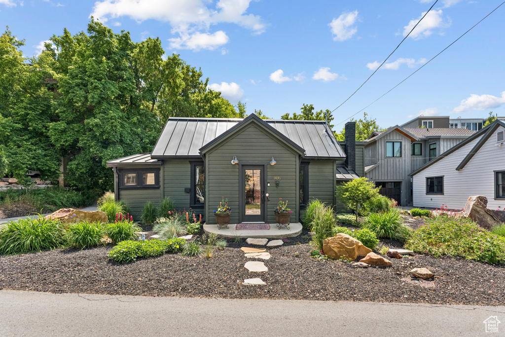View of front of home featuring a standing seam roof and a metal roof