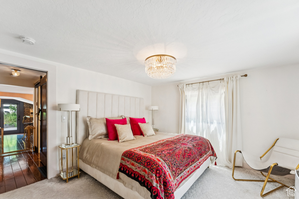 Bedroom featuring a chandelier