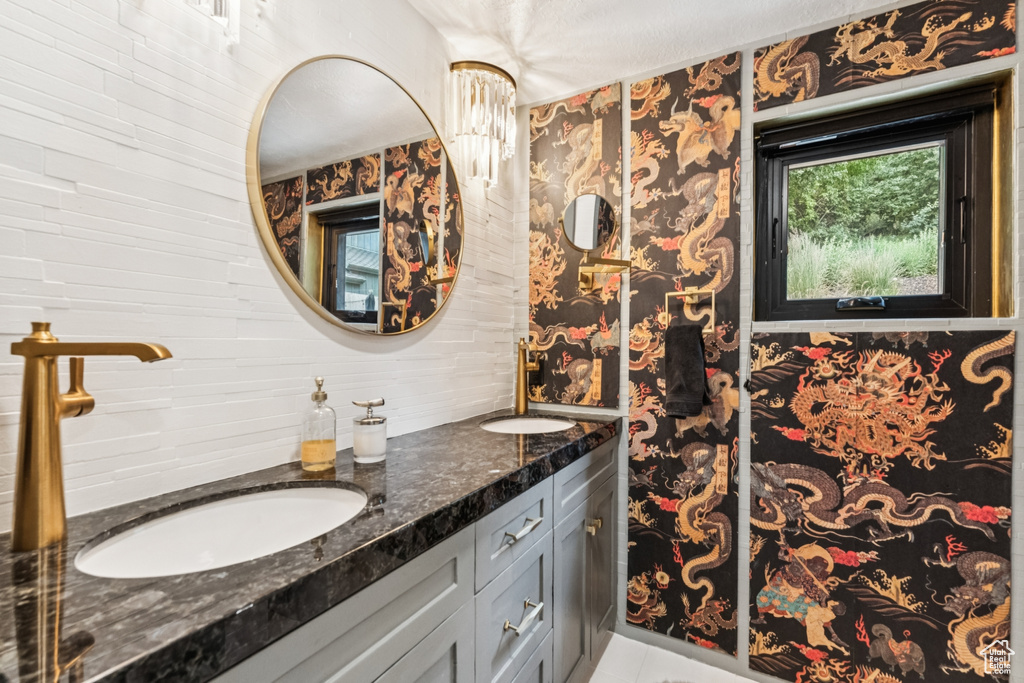 Bathroom featuring double vanity and tile patterned flooring