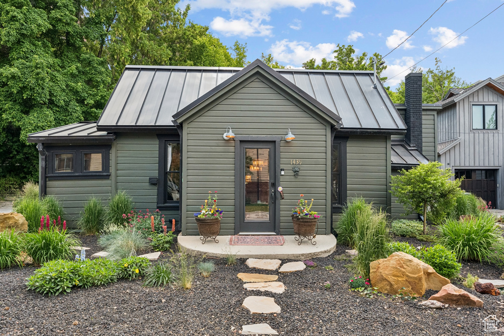 View of front of home featuring a standing seam roof and a metal roof