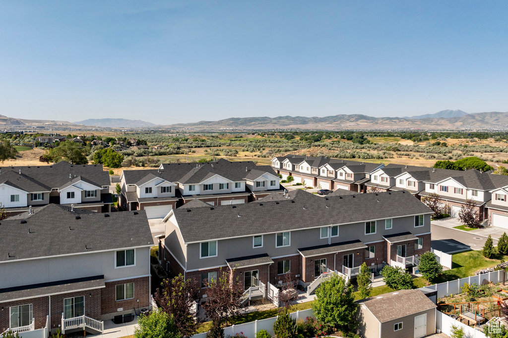 Aerial view of residential area featuring a mountain backdrop