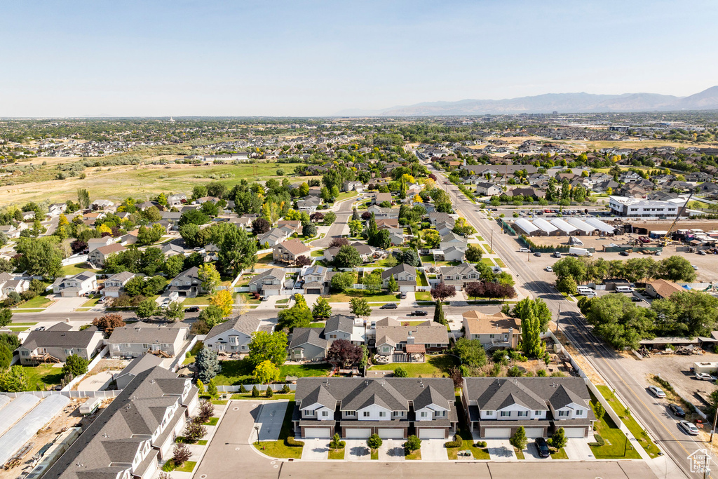Aerial view of residential area with a mountain backdrop
