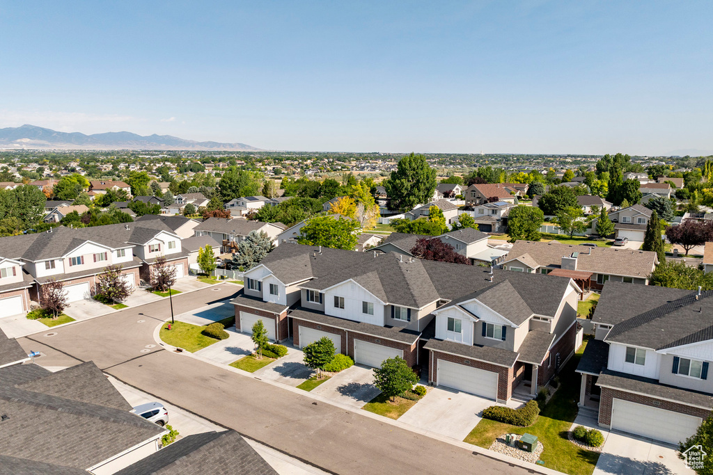 Aerial view of residential area featuring a mountain backdrop