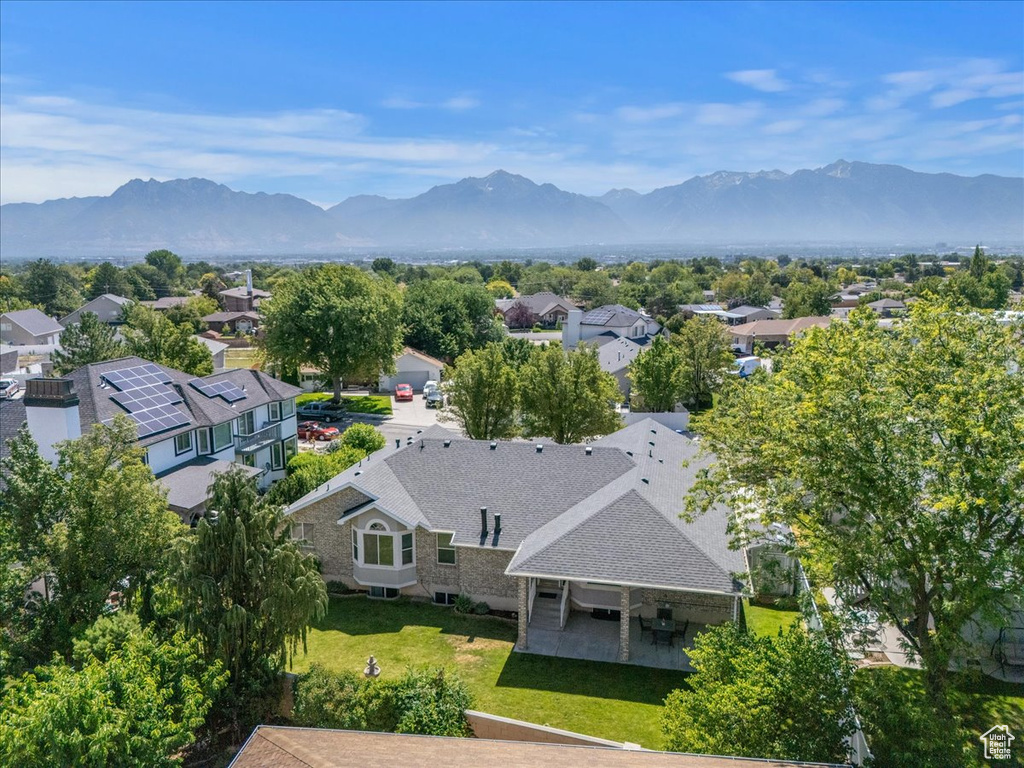 Aerial perspective of suburban area featuring a mountain backdrop