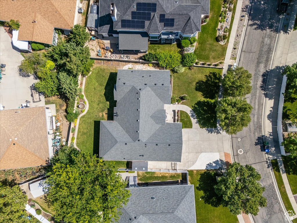 Aerial view of property's location with nearby suburban area