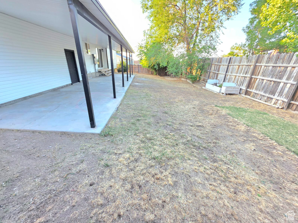 Fenced backyard featuring a patio area
