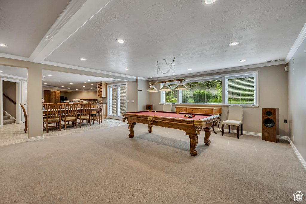 Rec room with billiards table, recessed lighting, crown molding, and light carpet