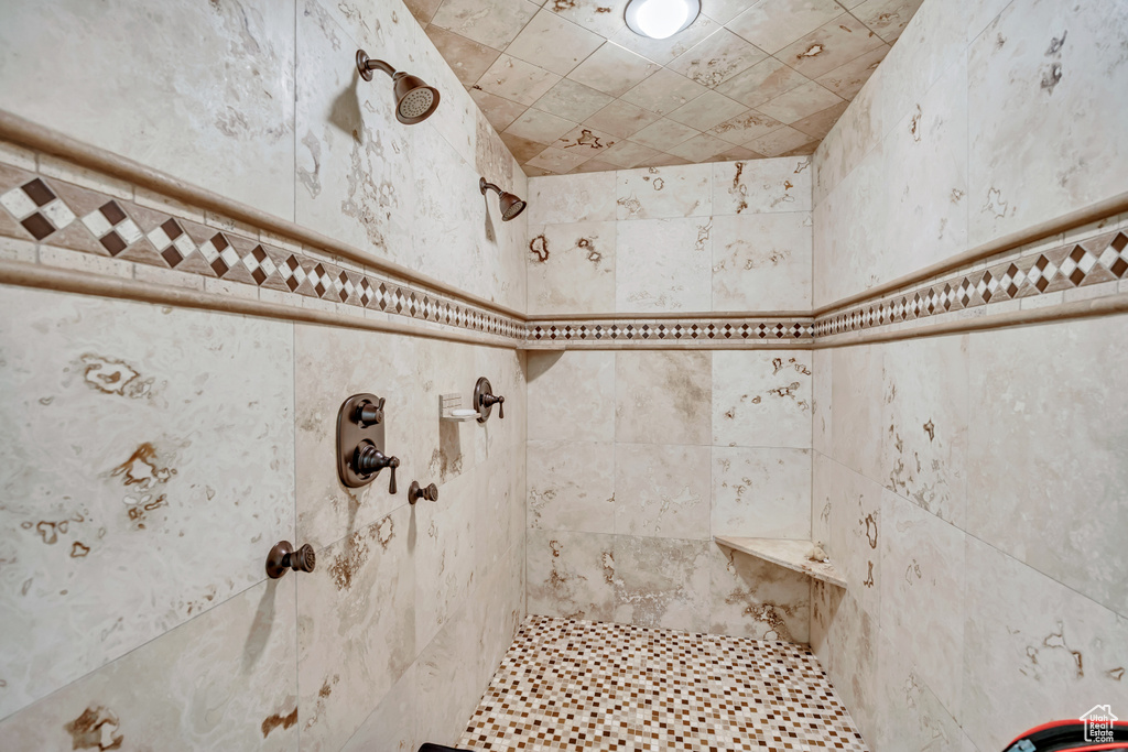 Bathroom featuring a tile shower