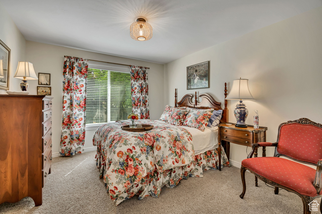 Bedroom with carpet flooring and baseboards