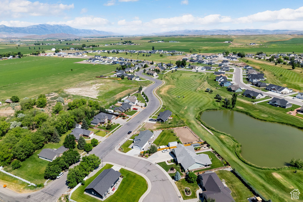 Aerial overview of property\\\'s location with a water and mountain view and nearby suburban area