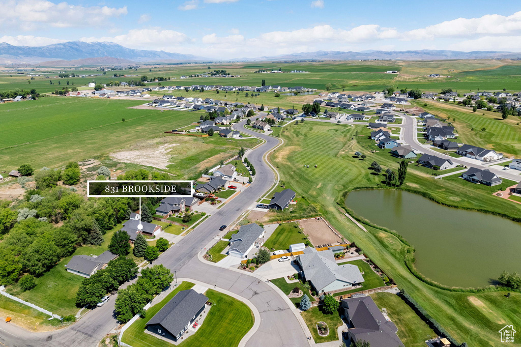 Aerial overview of property\\\'s location featuring a water and mountain view and nearby suburban area