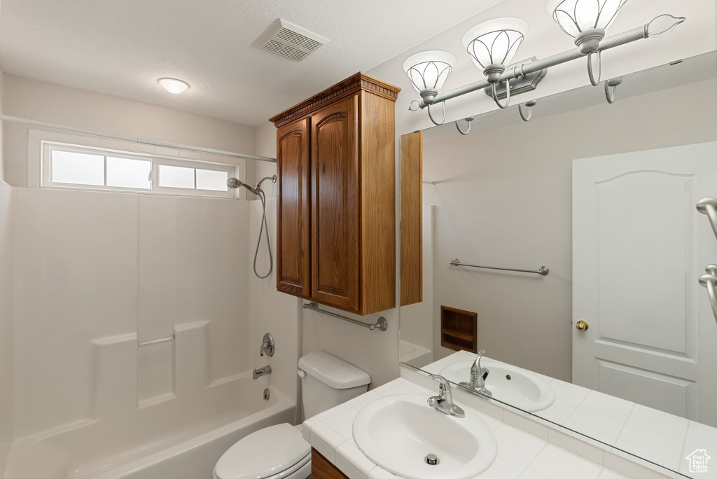 Bathroom featuring vanity and bathtub / shower combination