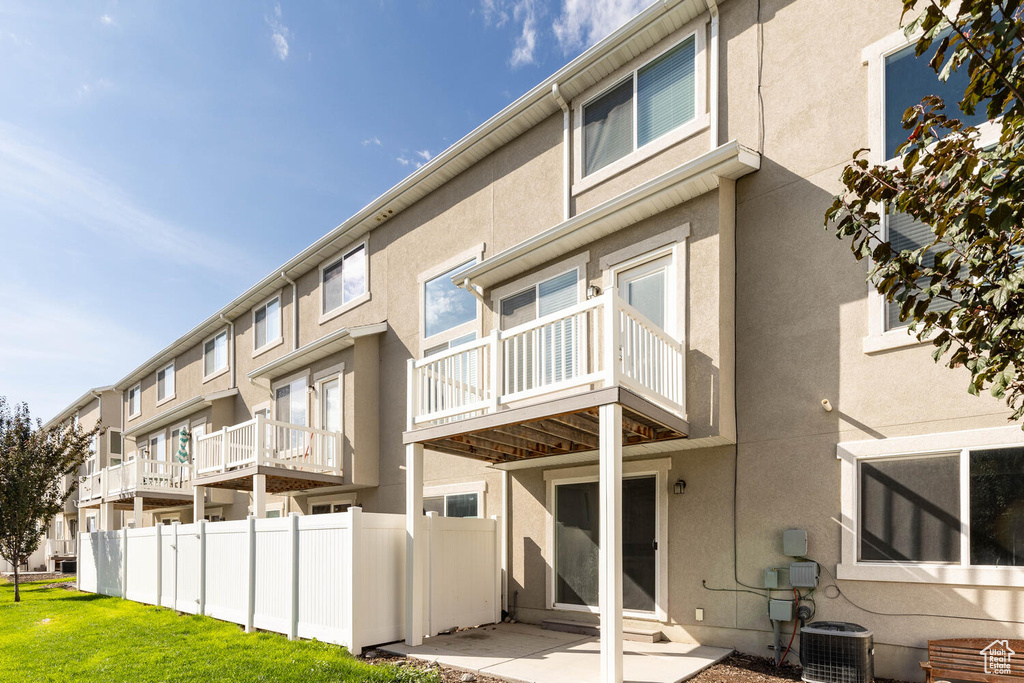 Rear view of property featuring stucco siding