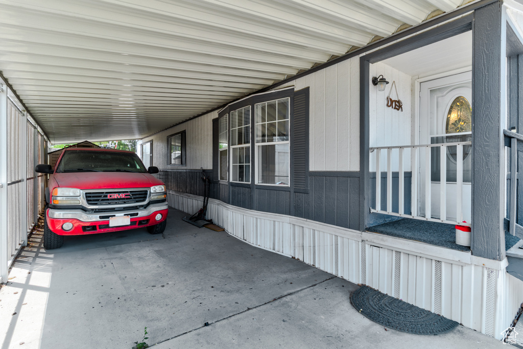 View of side of home featuring a carport