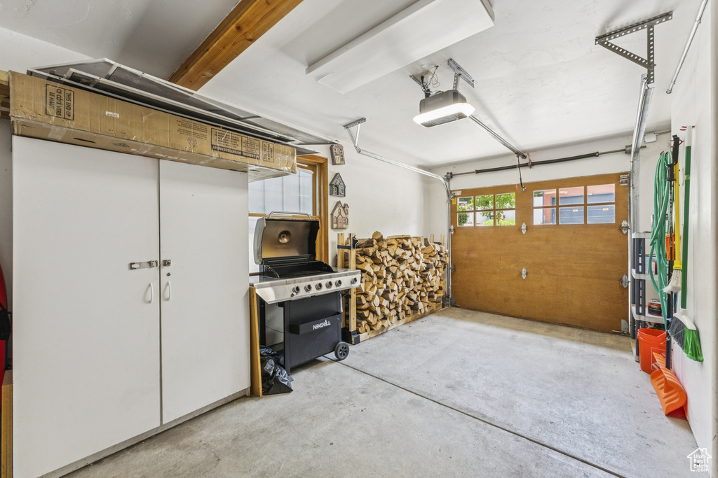 Garage featuring a garage door opener
