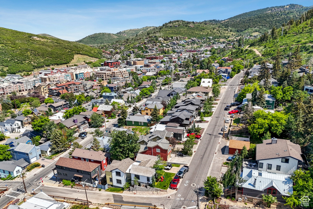 Aerial perspective of suburban area with a mountain backdrop