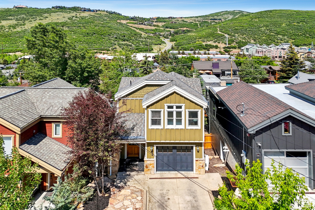 Aerial view of residential area with a mountainous background