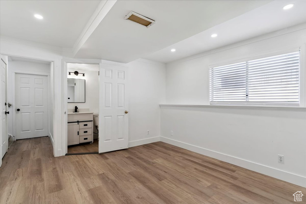 Unfurnished bedroom with light wood-type flooring and recessed lighting
