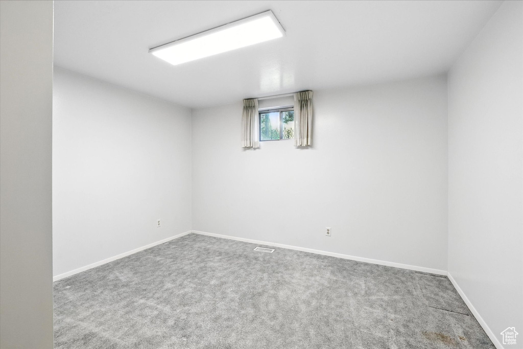 Basement with carpet flooring and baseboards
