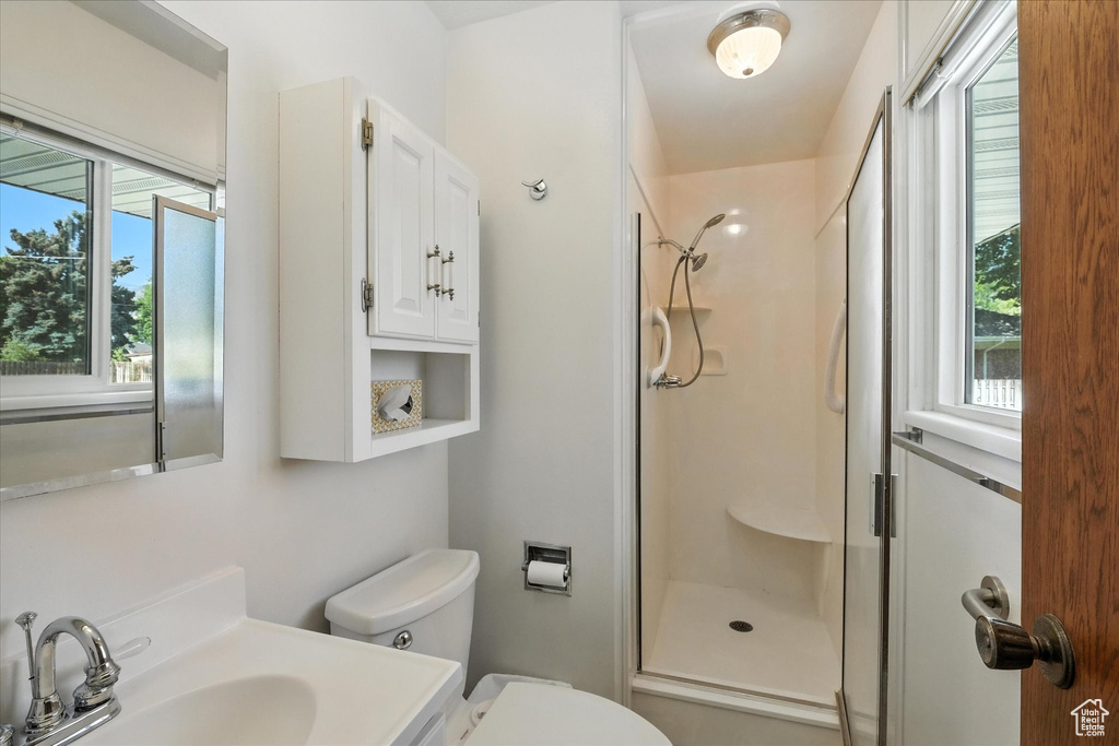 Bathroom featuring a stall shower and vanity