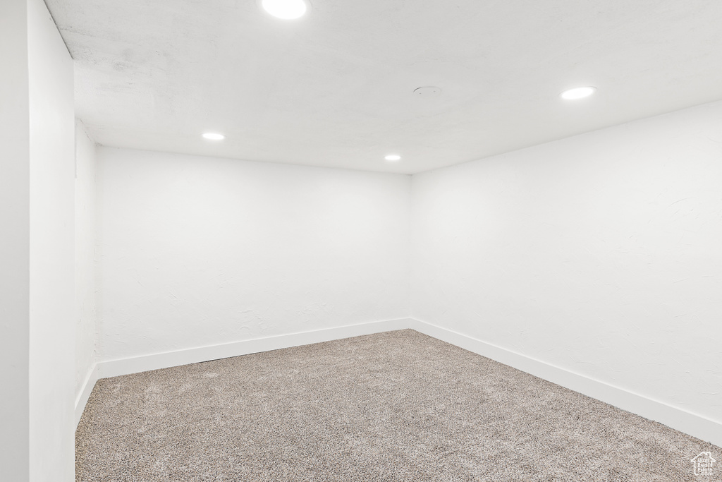 Unfurnished room featuring carpet flooring and recessed lighting