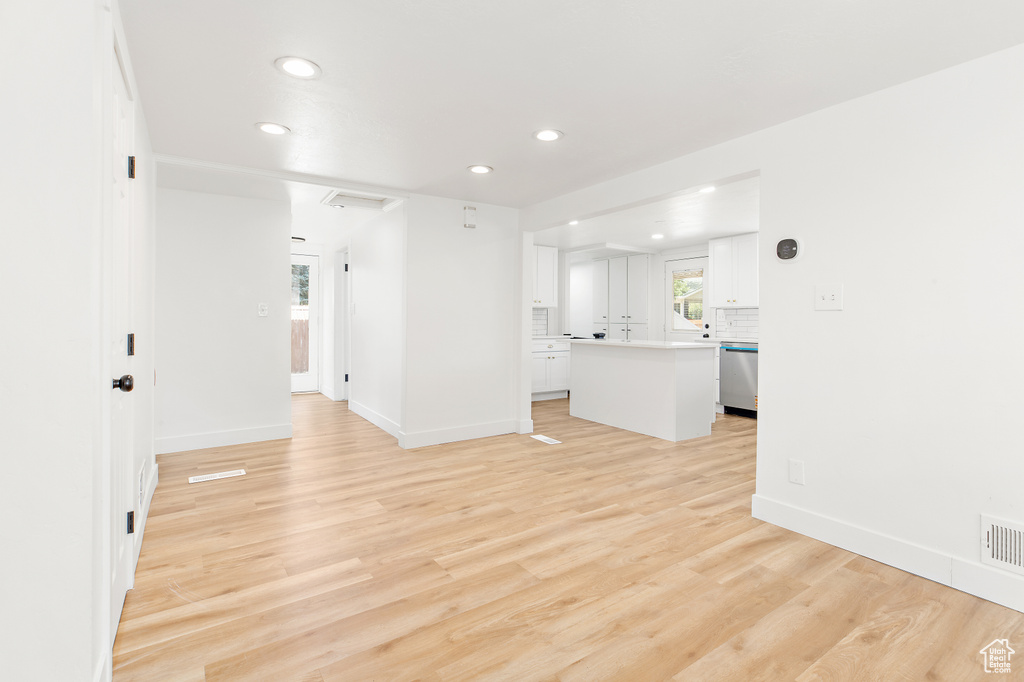 Unfurnished living room with recessed lighting and light wood finished floors