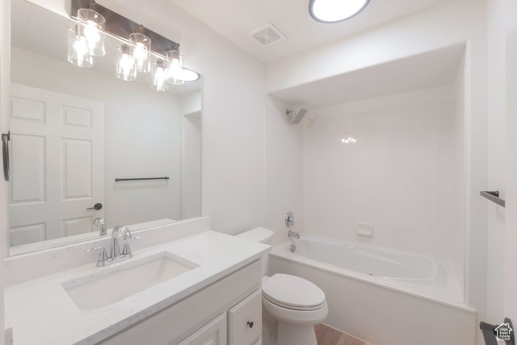Full bath featuring vanity and shower / tub combination