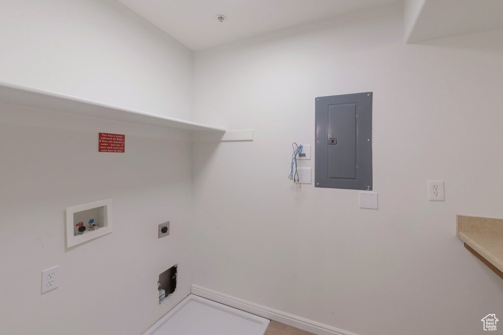 Laundry room with electric panel, washer hookup, and hookup for an electric dryer