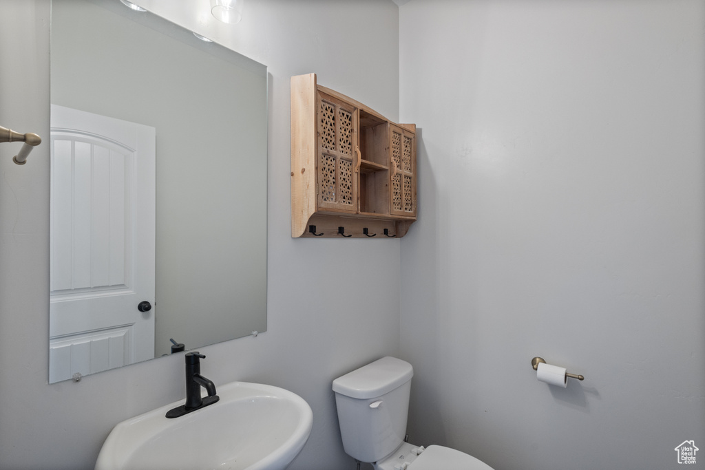 Bathroom featuring a sink and toilet