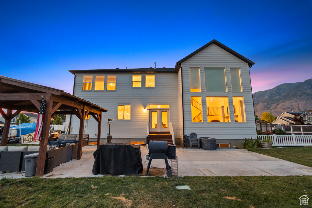 Back of house with a gazebo, a patio area, outdoor lounge area, entry steps, and a mountain view