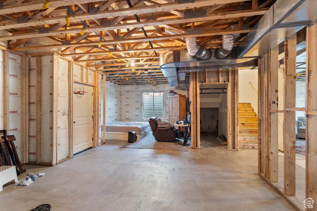 Basement featuring stairs