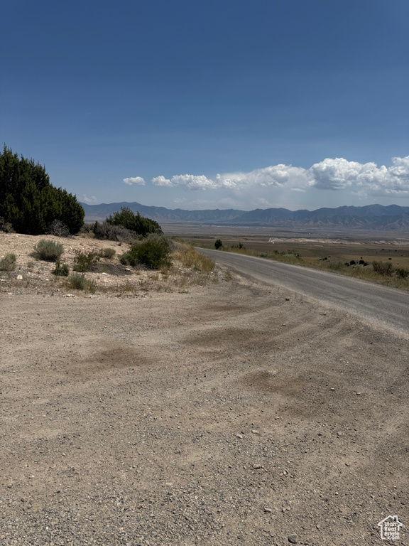 View of mountain background featuring rural landscape