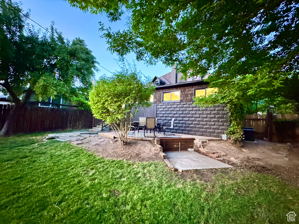 View of yard featuring a wooden deck