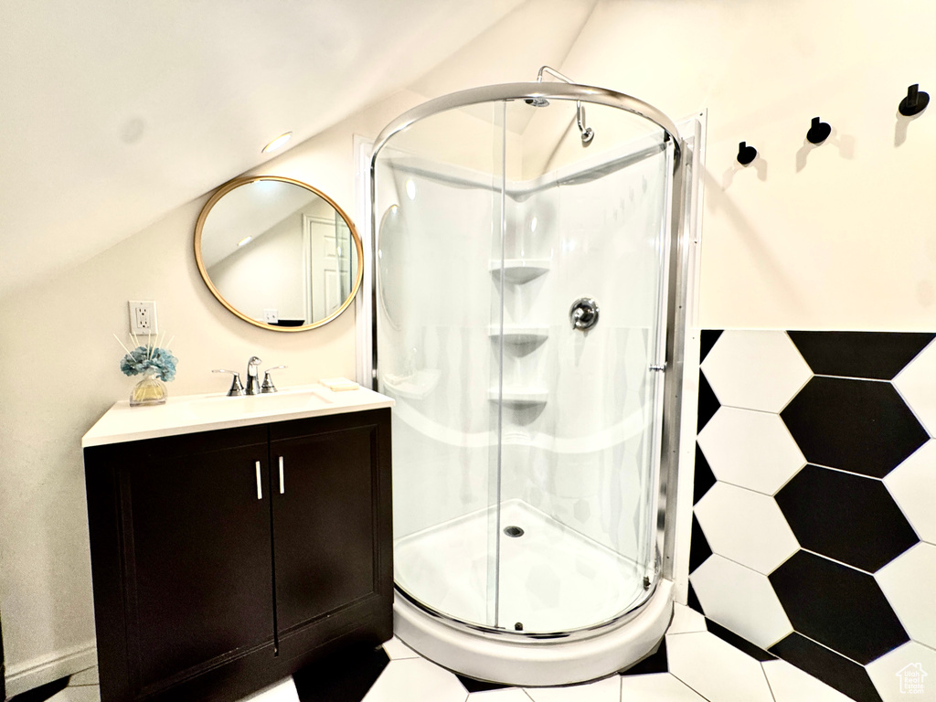 Full bathroom featuring vanity and a stall shower