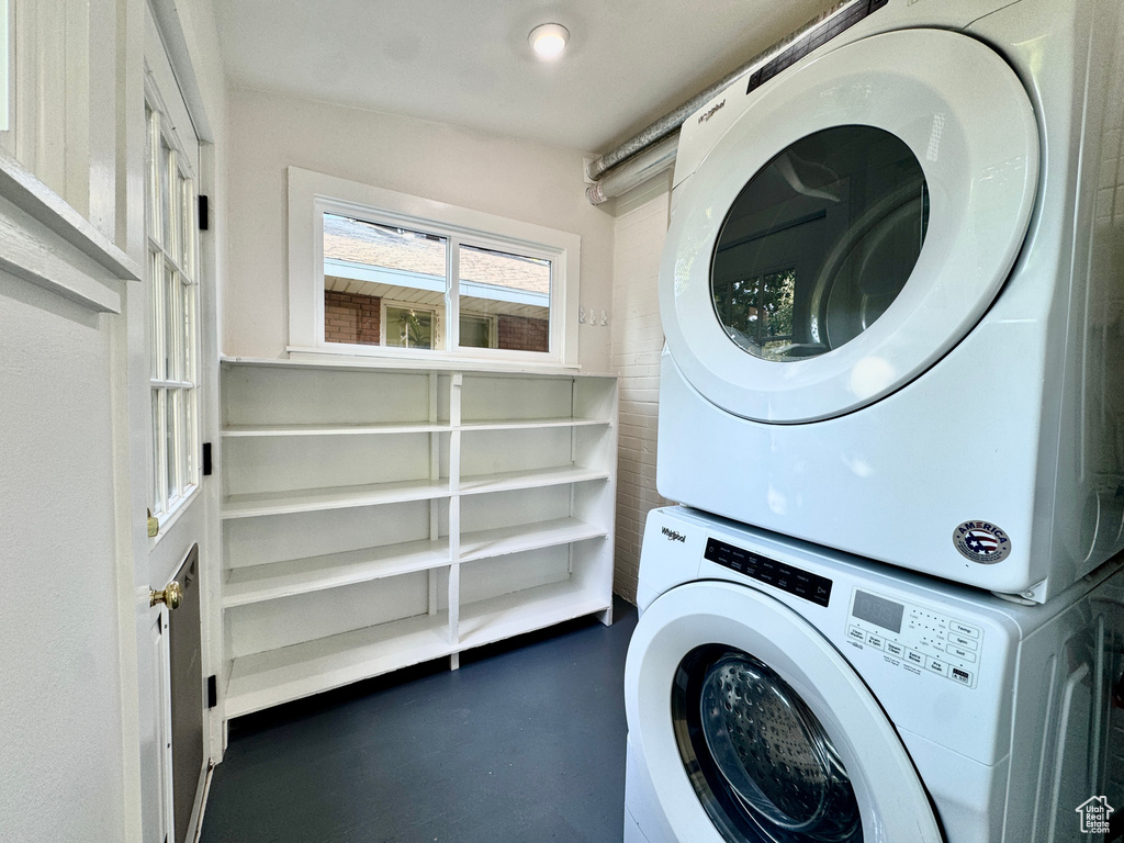 Laundry room featuring estacked washer and dryer