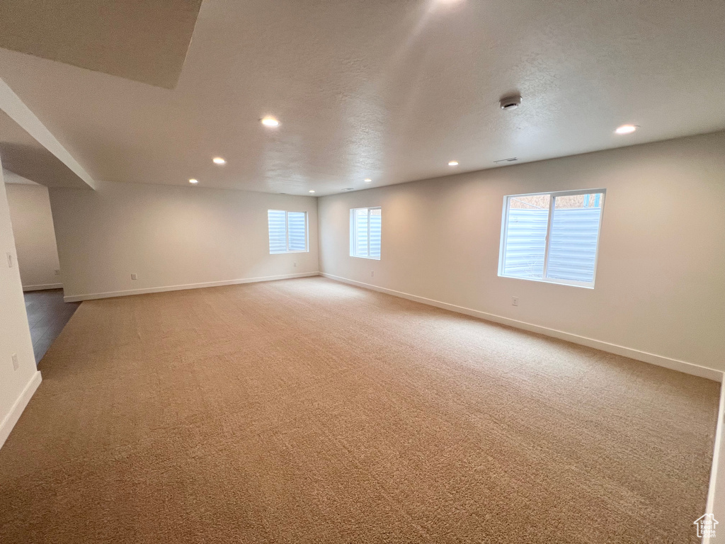 Spare room with recessed lighting and carpet floors