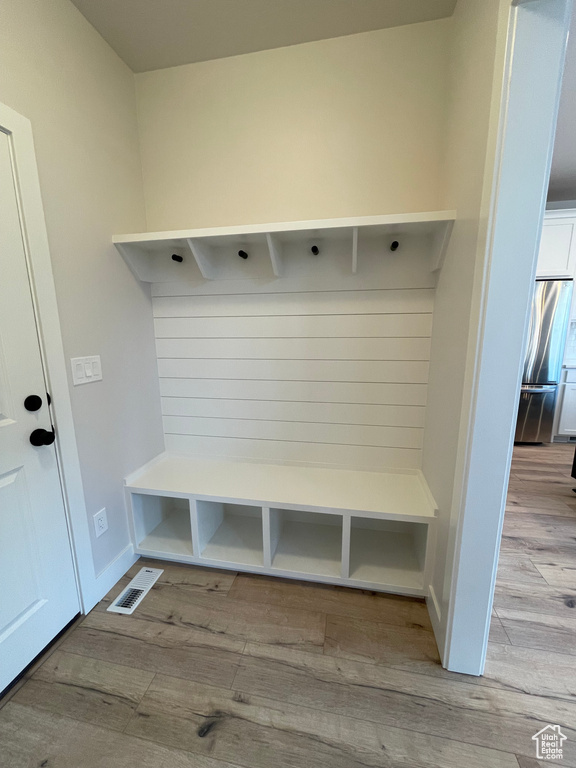 Mudroom with light wood-style flooring
