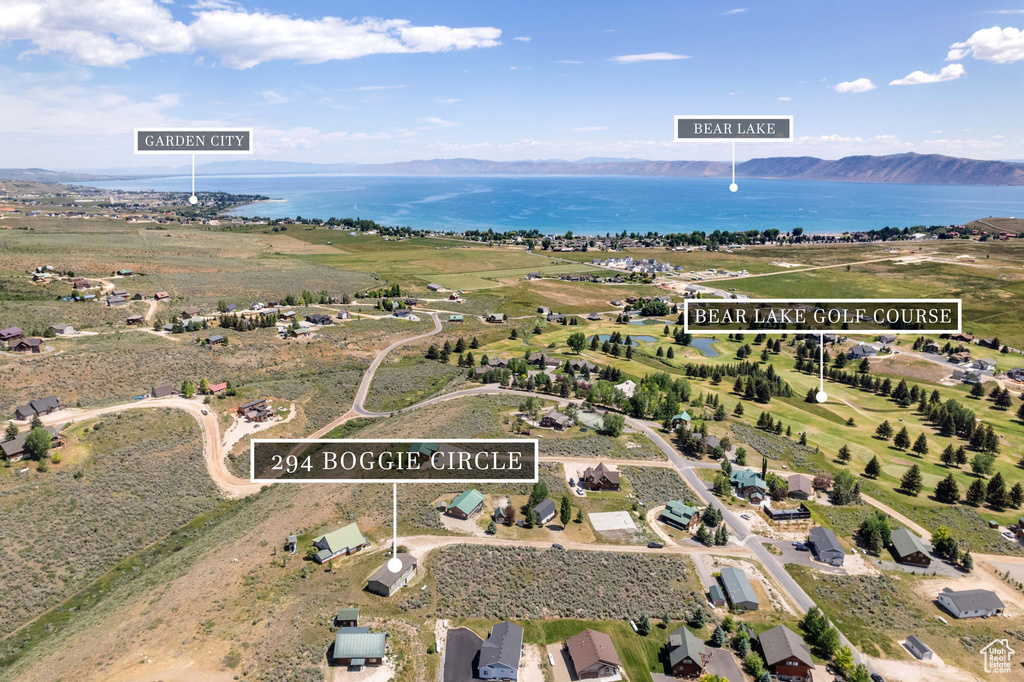 Aerial view of property's location with a water and mountain view
